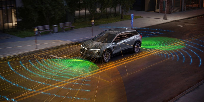 Gray 2025 Chevrolet Blazer EV in street showing green sensors in front and back of vehicle
