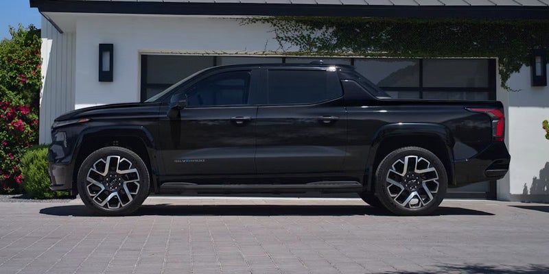 Black 2025 Chevrolet Silverado EV outside in driveway